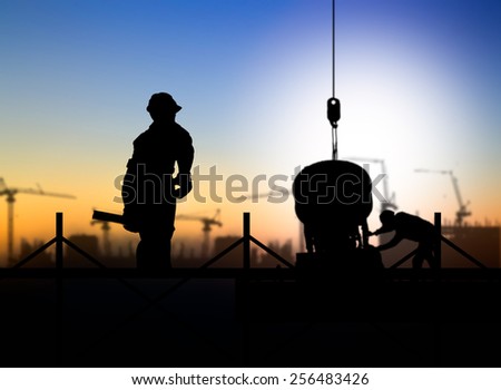 silhouette man engineer looking  a building site over Blurred construction worker on construction site