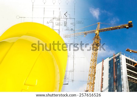 Safety helmet, blueprint and construction site. Construction concept.