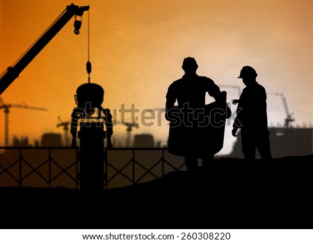 silhouette man engineer looking at blueprints in a building site over Blurred construction worker on construction site