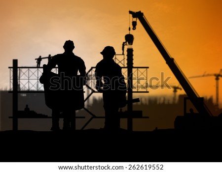 silhouette man engineer looking construction worker in a building site over Blurred construction site