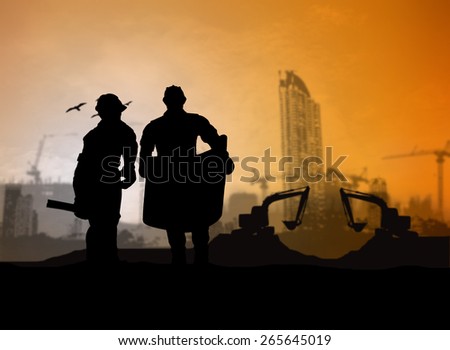 silhouette man engineer looking Loaders and trucks in a building site over Blurred construction worker on construction site
