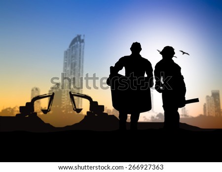 silhouette engineer looking Loaders and trucks in a building site over Blurred construction worker on construction site