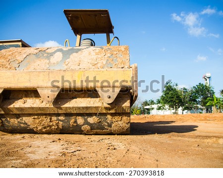 soil vibration roller during sand compacting works at construction site