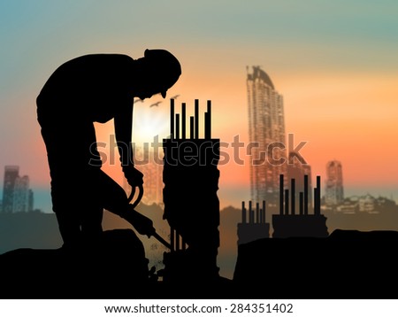 silhouette of construction worker on construction site