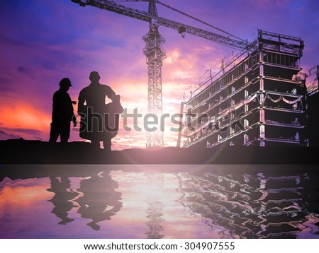 silhouetteengineer working  in a building site over Blurred construction worker on construction site