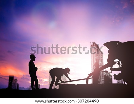 silhouette engineer looking work a building site over Blurred construction worker on construction site