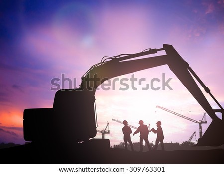 silhouette engineer  in a building site over Blurred construction site