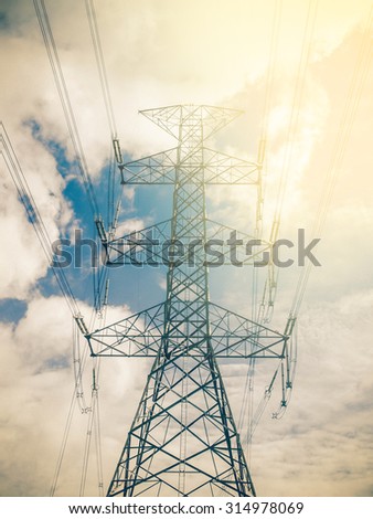 high voltage post.High-voltage tower sunset. Instagram effect (vintage)