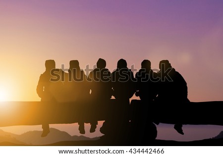 Silhouette friends imaging touch cold on the mountain peaks in winter. Dear friend, do not leave each other. Concept friends Party. The coalition parties in the holiday New Year. Day thanks to God