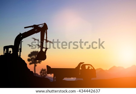 silhouette Excavator and truck working at construction site. Construction used heavy machinery to move earth. concept construction and heavy industry, machine will be used in heavy industry business.