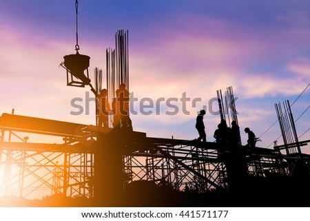 Silhouette construction industry engineer standing orders for construction team to work safely on high ground over blurred background sunset pastel for industry background. heavy industry concept.