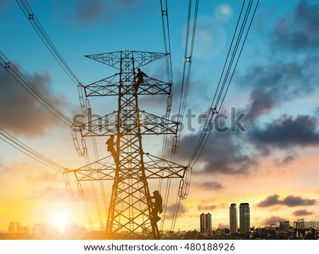 silhouette engineer repair and electrical installation work on high voltage pylons over Blurred construction site.CSR ESG Business on industry, People, Science, Technology, Transportation concept.