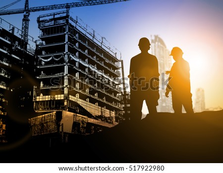 Business Industrial,People,personal and career growth, progress and potential concepts.silhouette Businessman engineer looking blueprint in a building site over Blurred construction site. film grain