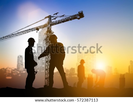 Silhouette team business industrial inspection and ordered construction site jobs over blurred natural. Motivate employee growth concept.
