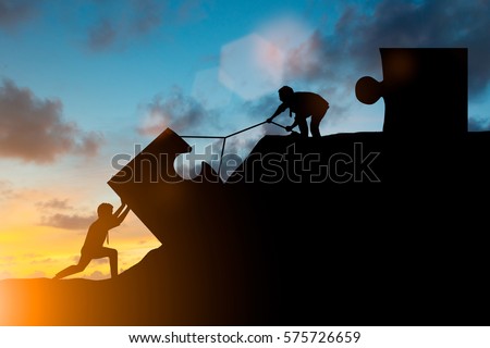Silhouette team business helps to systematically patience hard work and the pressure to reach the finish line over blurred natural. Motivate employee growth concept. jigsaw