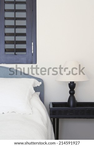 Bed and bedside table with lamp