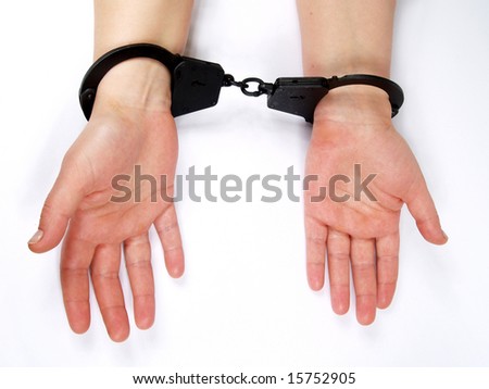 feminine hands shackled in manacles