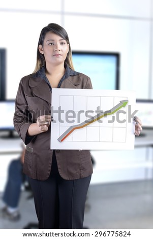 Business Woman Holding a Grow Up Graph