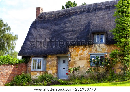 Traditional Old English Cottage with Thatched Roof