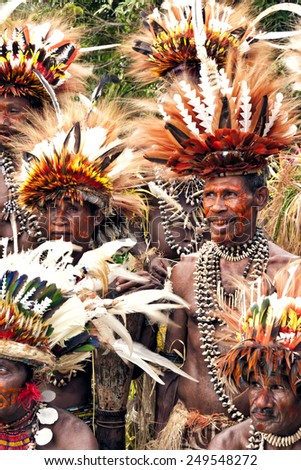 Tufi, Papua New Guinea, 4 December 2008 : Papuan Korafe tribe warriors wearing traditional bird of paradise feather headdress and body decorations during local festival