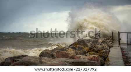Huge crashing wave against rocks