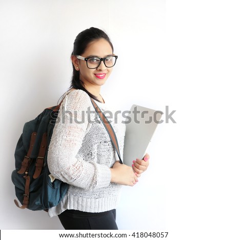 A Young Beautiful Indian College Student Holding Laptop on Isolated White Background