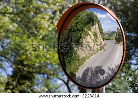 Defensive driving mirror with landscape reflected on it