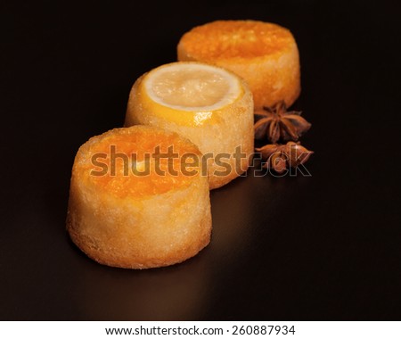 vivid citrus cupcakes on a dark background