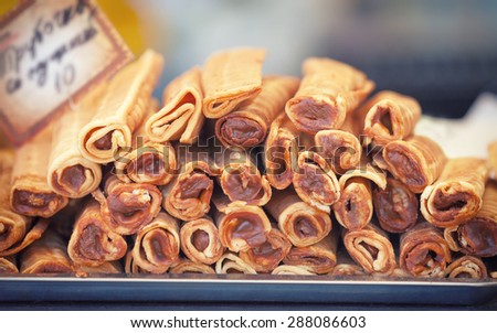 Delicious sweet buffet with rolled waffles with chocolate cream