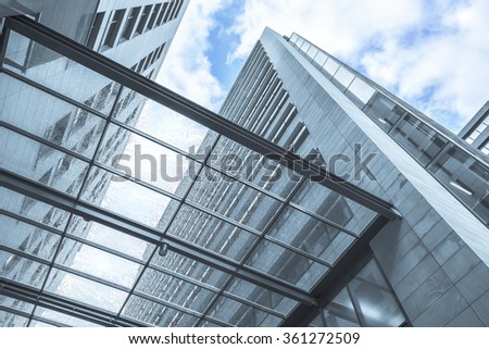 Perspective view from below through transparent wet canopy of modern building