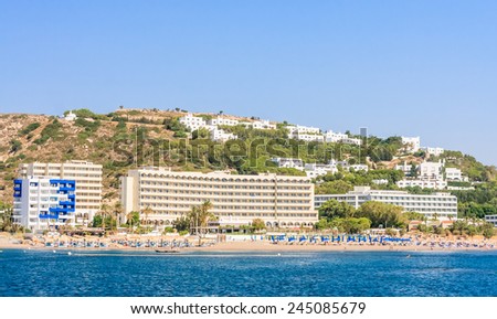 FALIRAKI, RHODES ISLAND. GREECE - JULY 28, 2014: Beach and  hotel on Rhodes island in Faliraki village, Greece. Greek islands are popular tourist destination for many Europeans