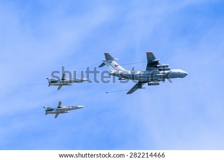 MOSCOW/RUSSIA - MAY 9: Il-78 (Midas) aerial tanker demonstrates refueling of 2 Su-24 (Fencer) supersonic attack aircrafts on parade devoted to 70-th Victory Day aniversary on May 9, 2015 in Moscow.