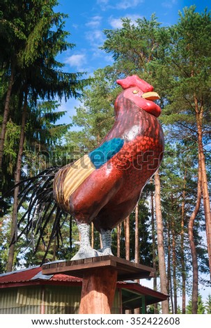 DRUSKININKAI, LITHUANIA - JULY 13, 2015: Sculpture cock at the entrance to the zoo. Grutas Park. Grutas park is a sculpture garden of Soviet-era statues and Soviet ideological relics