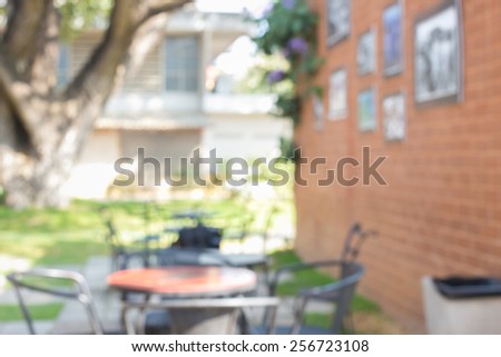 Table over outdoor restaurant blur background.