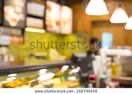 Blurred background : Vintage filter ,Barista at Coffee shop counter service blur background with bokeh.