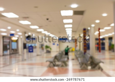 Blurred waiting chairs zone in airport,use as background.