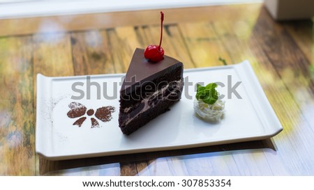 chocolate cake with blueberry cream and dark cocoa icing.