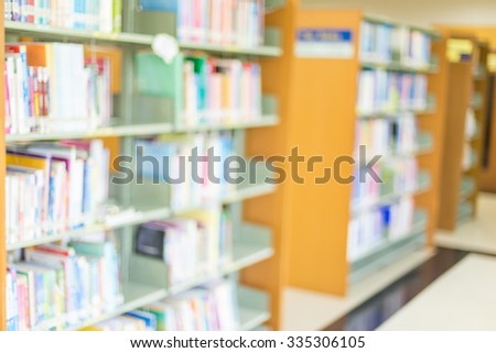 books on bookshelf in library, abstract blur defocused background.