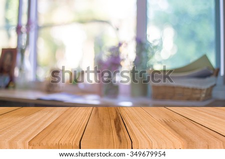 Selected focus empty brown wooden table and Coffee shop blur background with bokeh image.