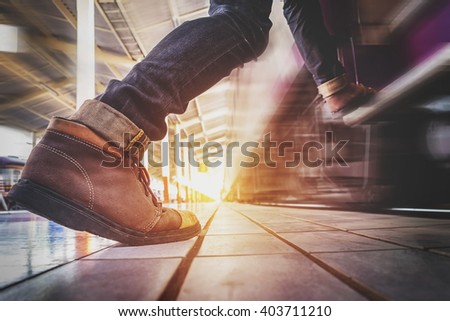Traveler man running and hurry to catch and enters to the train, vintage effect tone