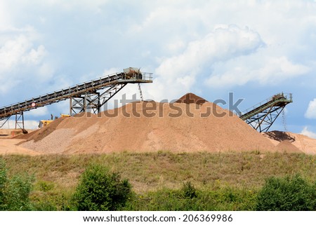Quarry work - stone piles with conveyor belts