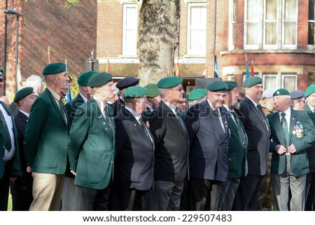 BEDFORD, ENGLAND  NOVEMBER 2014: Remembrance Day Parade - Veterans paying their respects to their fallen comrades, shown on 9 November 2014 in Bedford