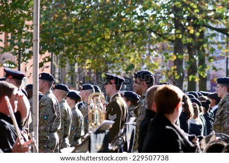BEDFORD, ENGLAND  NOVEMBER 2014: Remembrance Day Parade - Salvation Army band and soldiers standing to attention, shown on 9 November 2014 in Bedford