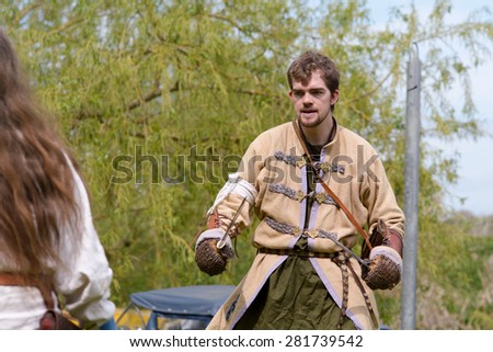 WILLINGTON, BEDFORDSHIRE, ENGLAND â?? MAY 4: Viking sword-fighting re-enactment at free to attend display. Viking warriors were showing combat techniques and weapons usage on May 4, 2015 in Willington.