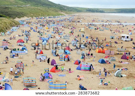 Beach full of tourists in summer in England