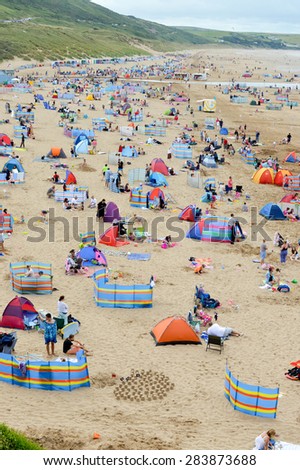 Beach full of tourists in summer in England