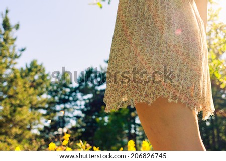 Girl\'s dress touched by summer light