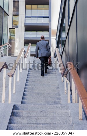 Business man walking to office in the morning