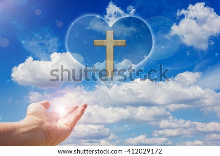 Crucifix or cross and god light on heart freedom sky background  with hand and lens flare, crucifix and cross with happiness bless light