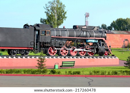 Old steam locomotive on the pedestal